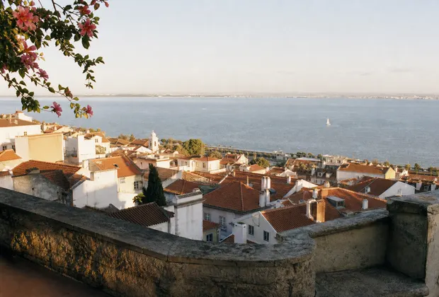 Terracotta rooftops descending toward the Tagus river